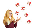 Photo: beautiful blonde woman catching falling christmas gifts beautiful blonde woman catching falling christmas gifts