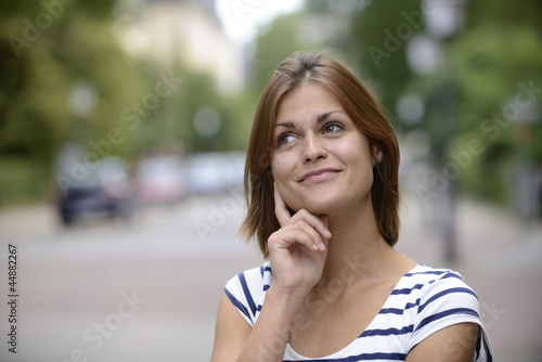 Photo: woman having an idea outdoors woman having an idea outdoors