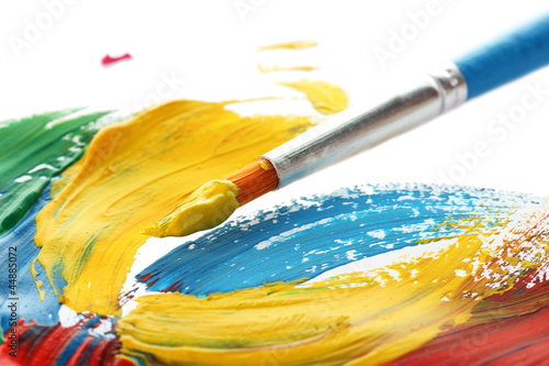 Photo: Abstract gouache paint and brush, isolated on white Abstract gouache paint and brush, isolated on white