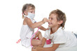 two children playing as doctor and patient isolated over white