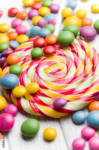 Photo: colored candy and lollipop colored candy and lollipop