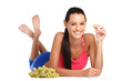 brunette teeanger lying on the floor with fruit