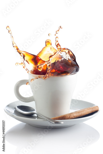 Photo: coffee splash in a cup coffee splash in a cup