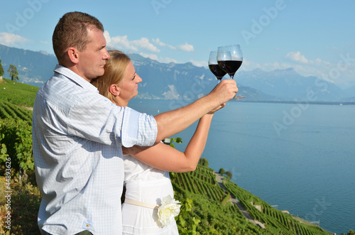 Photo: Man and woman tasting wine. Lavaux, Switzerland Man and woman tasting wine. Lavaux, Switzerland