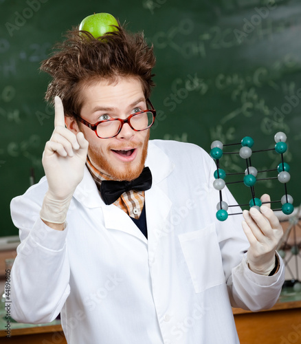 Photo: Mad scientist with a green apple on his head Mad scientist with a green apple on his head