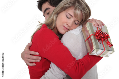 Photo: Woman thanking her boyfriend for his gift Woman thanking her boyfriend for his gift