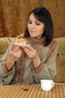 Beautiful Caucasian woman sitting at a table with a cake