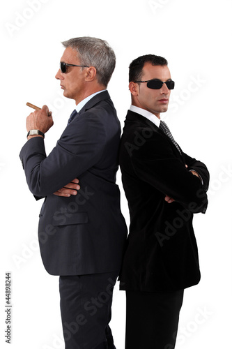 Photo: Businessman wearing suits and sunglasses Businessman wearing suits and sunglasses