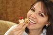 Beautiful woman sitting at a table with a cake
