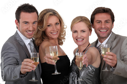 Photo: Four people toasting success Four people toasting success