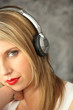 Blond women wearing headphones