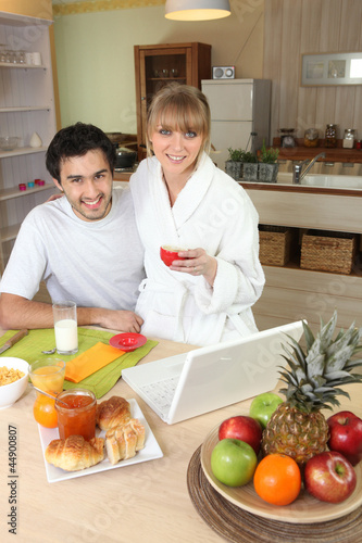Photo: Couple having breakfast together Couple having breakfast together