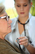 Photo: A middle age woman at the doctor. A middle age woman at the doctor.