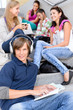 Students sitting on high-school stairs in break