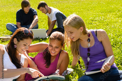 Photo: Teens studying in park reading book students Teens studying in park reading book students