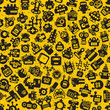 Cartoon robots faces seamless pattern on yellow.