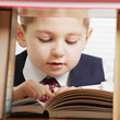 Schoolboy reading book