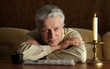 Beautiful Caucasian aged man sitting at a table