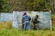 Photo: Paintball players in full gear at the shooting range Paintball players in full gear at the shooting range