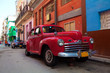 Vintage red car on the street of old city, Havana, Cuba