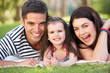 Photo: Family Relaxing In Summer Garden Family Relaxing In Summer Garden