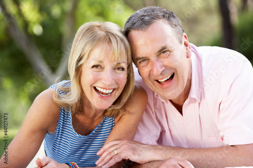 Photo: Senior Couple Relaxing In Summer Garden Senior Couple Relaxing In Summer Garden