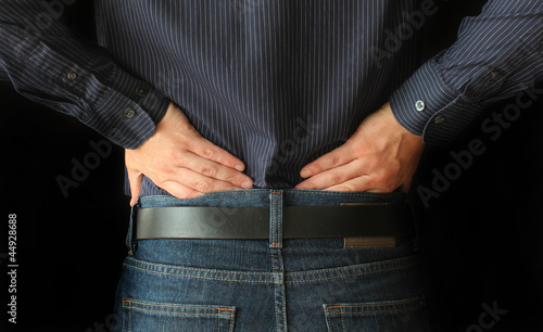 Photo: Man with back pain Man with back pain