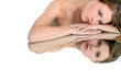 Woman resting her head and arms on a mirror