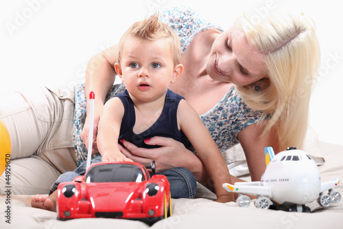 Photo: Little boy with radio-controlled car Little boy with radio-controlled car