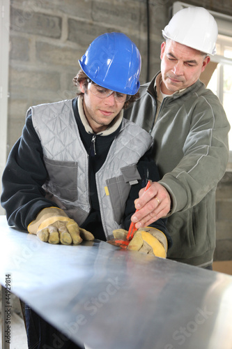 Photo: Apprentice and foreman on construction site Apprentice and foreman on construction site