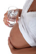 Pregnant woman with glass of water