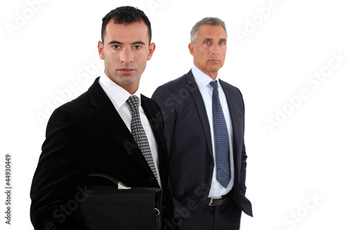 Photo: two businessmen posing two businessmen posing