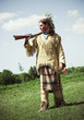 Photo: North American Indian in full dress. Reconstruction North American Indian in full dress. Reconstruction