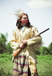 Photo: North American Indian in full dress. Reconstruction North American Indian in full dress. Reconstruction