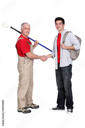 Photo: Decorator shaking hands with a young man Decorator shaking hands with a young man