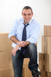 Ware house manager surrounded by boxes