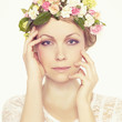 Photo: Beautiful young girl with flowers Beautiful young girl with flowers