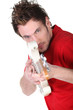 Man pretending electric guitar is a gun
