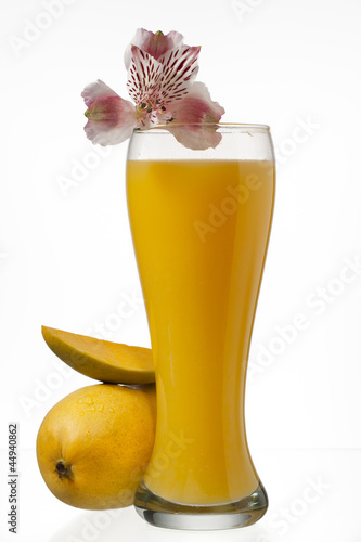 Photo: image of mangoes and juice glass image of mangoes and juice glass