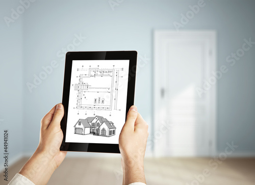 Photo: digital tablet and plan digital tablet and plan