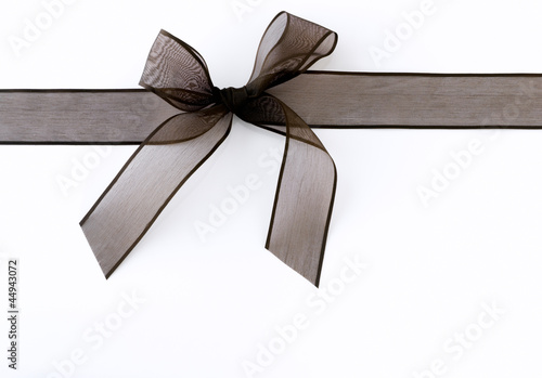Photo: Black ribbon against white background Black ribbon against white background