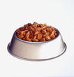 Dog food in bowl against white background