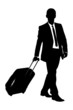 Vector: A silhouette of a business traveler carrying a suitcase A silhouette of a business traveler carrying a suitcase