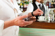 Barista with client in his cafe or coffeeshop