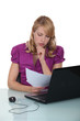Secretary reviewing paperwork