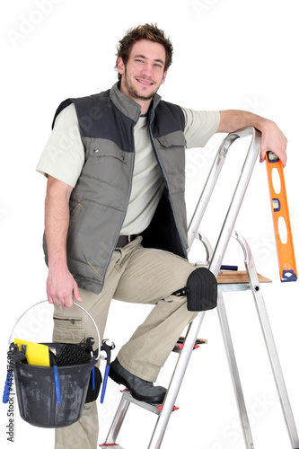 Photo: Tiler stood on ladder Tiler stood on ladder