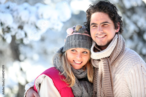 Photo: portrait of happy couple at winter resort portrait of happy couple at winter resort