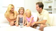 Parents Watching Daughters Saving Coins Money Pig