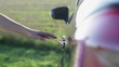 Woman's hand opening car door and getting into the car
