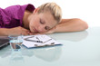 Female office worker asleep at desk